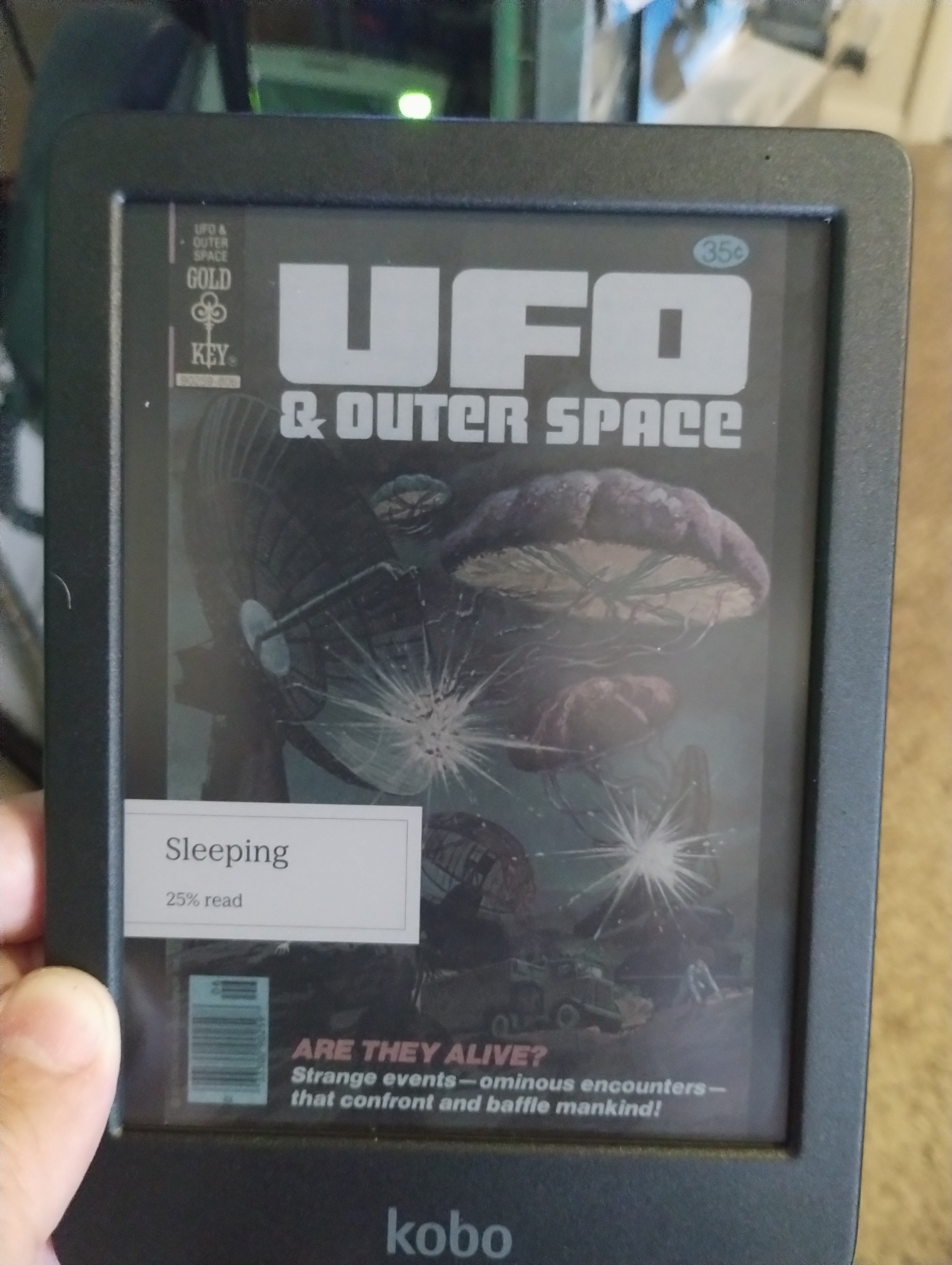 Kobo Clara Colour with a Gold Key UFO & Outer Space Comic book cover being displayed while the device is sleeping.